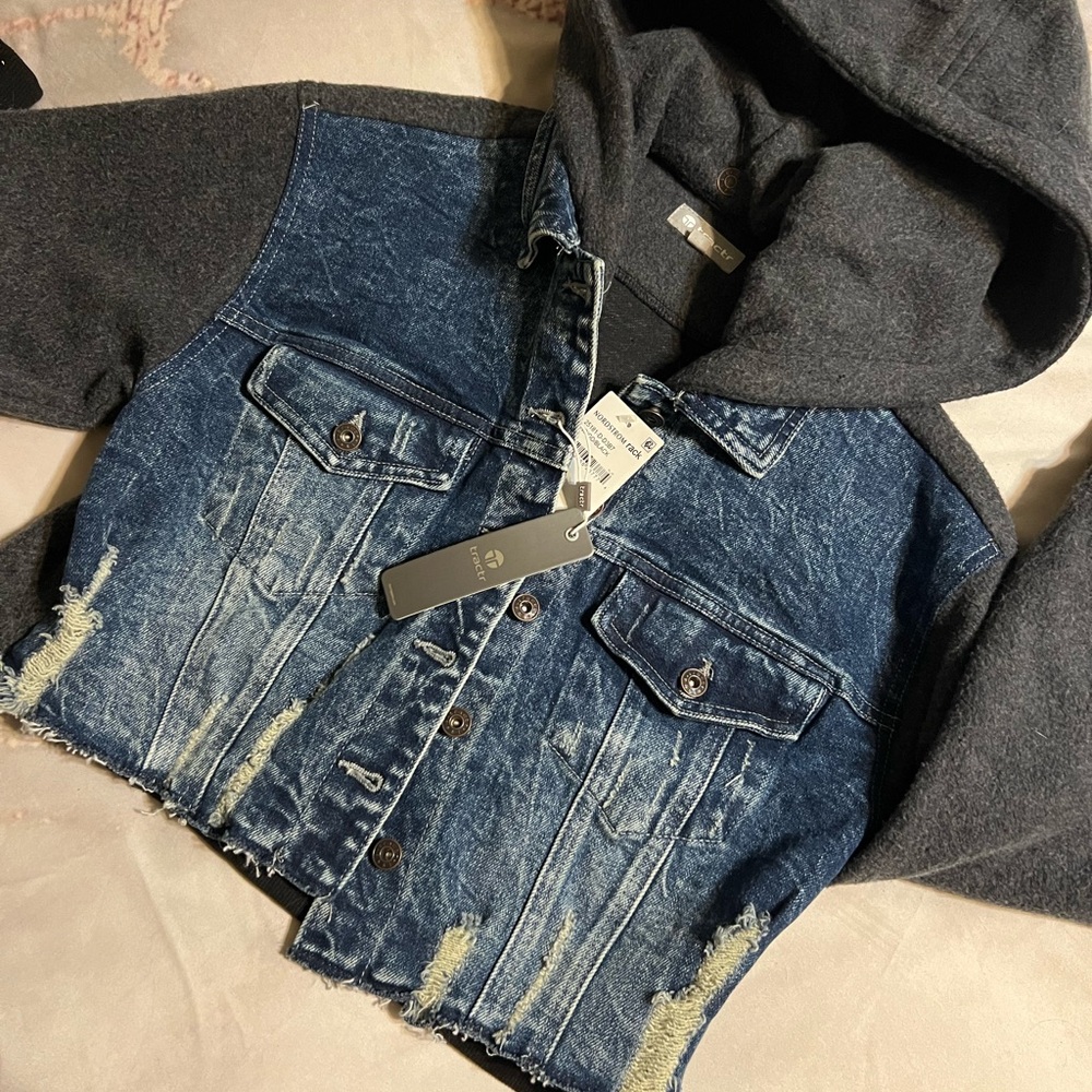 Denim jean jacket with snap hood that’s detachable. New tags.